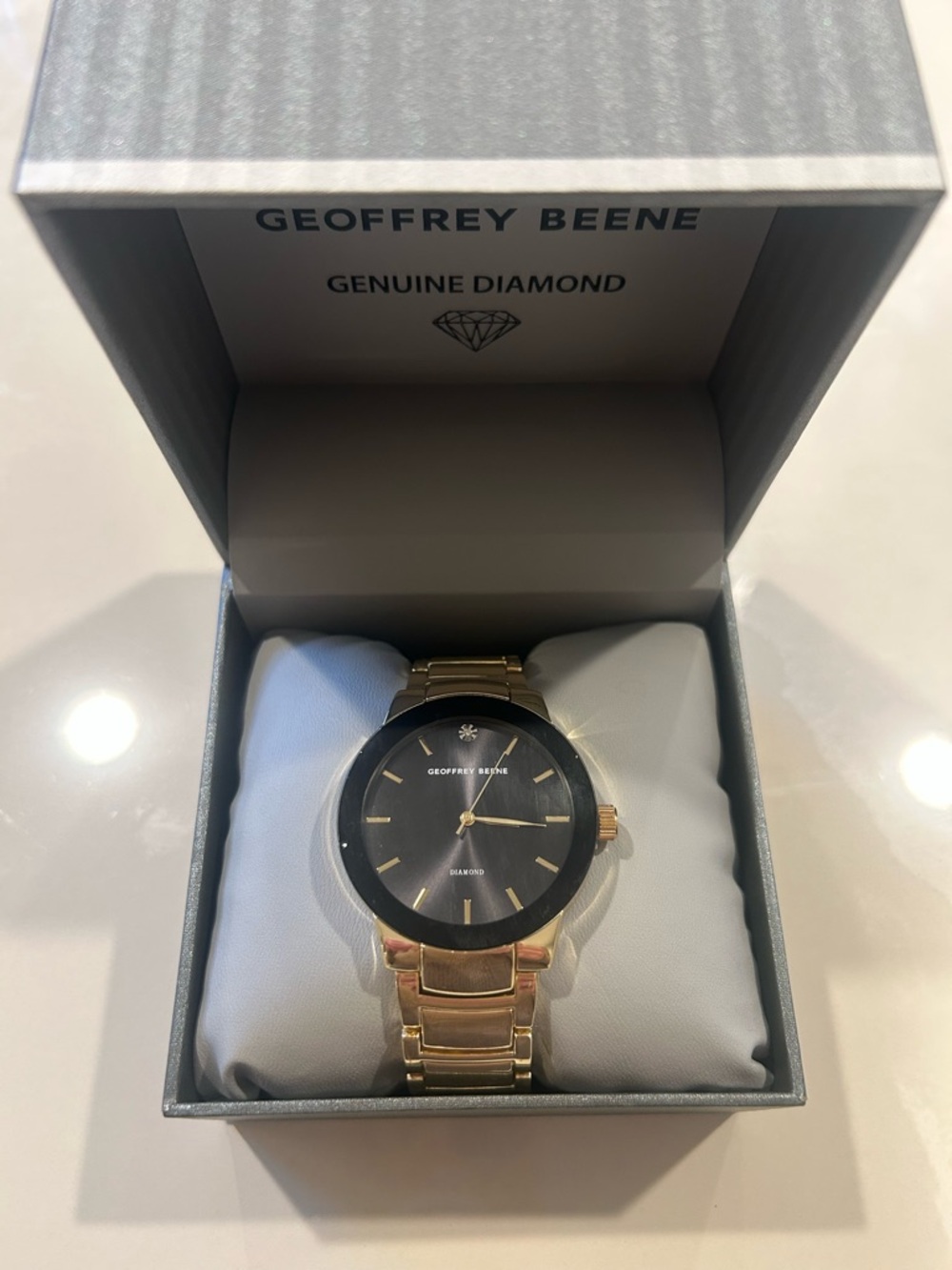 Geoffrey Beene Gold-Tone Watch with Black Dial